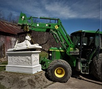 installing carving of large dog