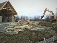 excavator setting stones at Gatineau Golf course