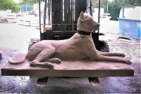 limestone dog carved from plaster model