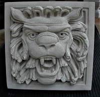 Lion's head carved for garden wall